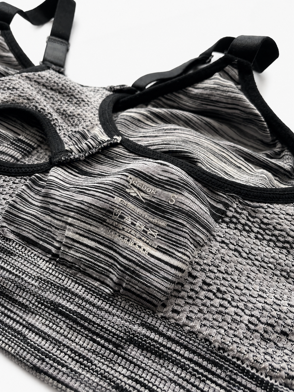 Top Deportivo Reebok PureMove Gris Jaspeado